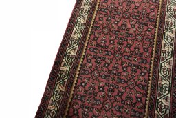 Backside of handmade 2000s Hamedan rug showing knot structure and weave density