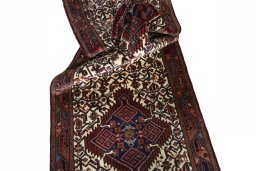 Close-up detail of 2000s Hamedan rug from Iran / Persia showing Wool weave