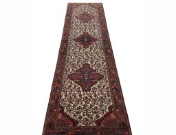 Surface texture of 2000s Hamedan rug with natural Wool and intricate pattern