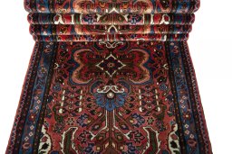 Corner detail of New Hamedan rug showing border pattern and Wool pile
