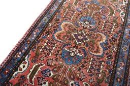 Backside of handmade New Hamedan rug showing knot structure and weave density