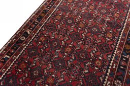 Backside of handmade 2000s Hamedan rug showing knot structure and weave density