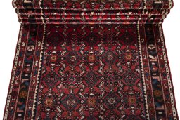 Full view of 2000s Hamedan rug from Iran / Persia, 522 × 110 cm in Red tones