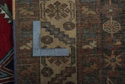 Backside of handmade 1930s Hamedan rug showing knot structure and weave density