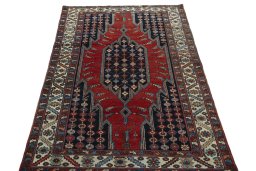 Surface texture of 1930s Hamedan rug with natural Wool and intricate pattern