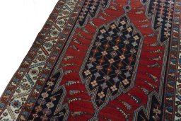 Backside of handmade 1930s Hamedan rug showing knot structure and weave density