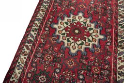 Backside of handmade New Hamedan rug showing knot structure and weave density