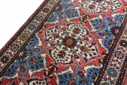 Backside of handmade New Hamedan rug showing knot structure and weave density