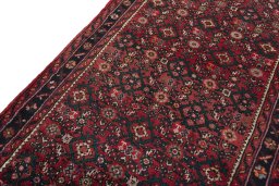 Backside of handmade New Hamedan rug showing knot structure and weave density