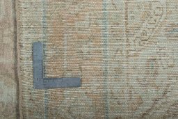 Backside of handmade 1950s Hamedan rug showing knot structure and weave density