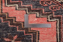 Corner detail of 1960s Hamedan rug showing border pattern and Wool pile