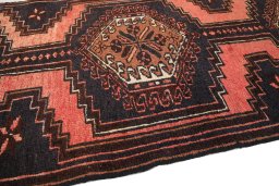 Backside of handmade 1960s Hamedan rug showing knot structure and weave density
