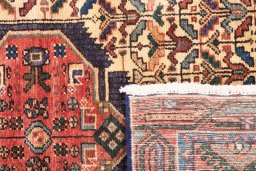 Close-up detail of 1992s Hamedan rug from Iran / Persia showing Wool weave