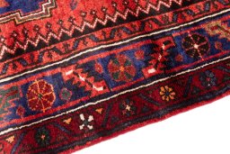 Backside of handmade 1970s Hamedan rug showing knot structure and weave density