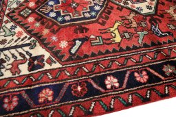 Backside of handmade 1990s Hamedan rug showing knot structure and weave density