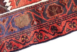 Backside of handmade 1975s Hamedan rug showing knot structure and weave density