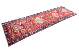 Corner detail of 1995s Hamedan rug showing border pattern and Wool pile