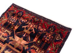 Surface texture of 1970s Hamedan rug with natural Wool and intricate pattern