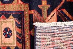 Close-up detail of 1970s Hamedan rug from Iran / Persia showing Wool weave
