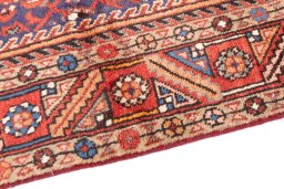 Backside of handmade 1996s Hamedan rug showing knot structure and weave density