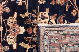 Close-up detail of 2001s Hamedan rug from Iran / Persia showing Wool weave