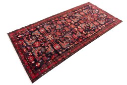 Corner detail of 1990s Hamedan rug showing border pattern and Wool pile