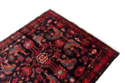 Surface texture of 1990s Hamedan rug with natural Wool and intricate pattern