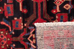 Close-up detail of 1990s Hamedan rug from Iran / Persia showing Wool weave