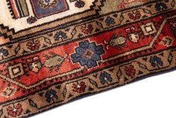Backside of handmade 1995s Hamedan rug showing knot structure and weave density