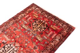 Surface texture of 1991s Hamedan rug with natural Wool and intricate pattern