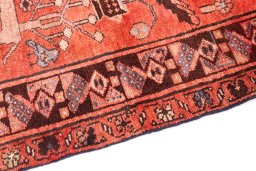 Backside of handmade 1991s Hamedan rug showing knot structure and weave density