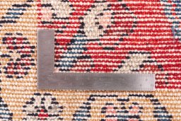 Corner detail of 1970s Hamedan rug showing border pattern and Wool pile