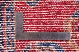 Corner detail of 1970s Hamedan rug showing border pattern and Wool pile