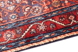 Backside of handmade 1986s Hamedan rug showing knot structure and weave density