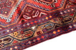 Backside of handmade 1997s Hamedan rug showing knot structure and weave density