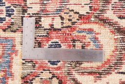Corner detail of 1975s Hamedan rug showing border pattern and Wool pile