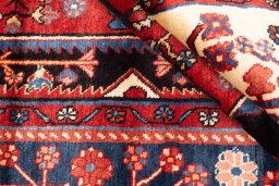 Corner detail of 1997s Hamedan rug showing border pattern and Wool pile