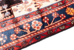 Backside of handmade 1997s Hamedan rug showing knot structure and weave density