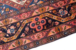Backside of handmade 1975s Hamedan rug showing knot structure and weave density