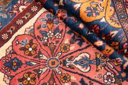 Corner detail of 1975s Hamedan rug showing border pattern and Wool pile