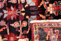 Close-up detail of 1998s Hamedan rug from Iran / Persia showing Wool weave