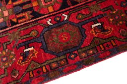 Backside of handmade 1975s Hamedan rug showing knot structure and weave density