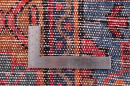 Corner detail of 1975s Hamedan rug showing border pattern and Wool pile