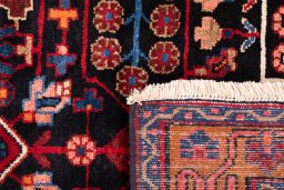 Close-up detail of 1975s Hamedan rug from Iran / Persia showing Wool weave