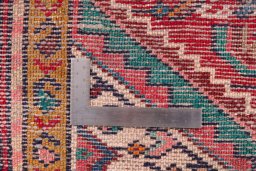 Corner detail of 1982s Hamedan rug showing border pattern and Wool pile