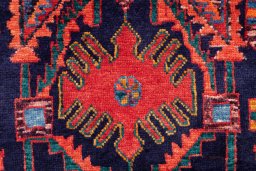 Corner detail of 1999s Hamedan rug showing border pattern and Wool pile