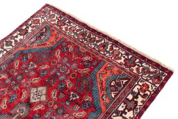 Surface texture of 1975s Hamedan rug with natural Wool and intricate pattern