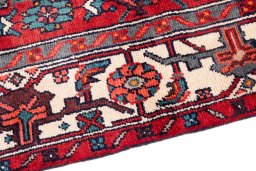 Backside of handmade 1975s Hamedan rug showing knot structure and weave density