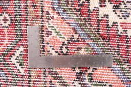 Corner detail of 2000s Hamedan rug showing border pattern and Wool pile