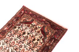 Surface texture of 2000s Hamedan rug with natural Wool and intricate pattern